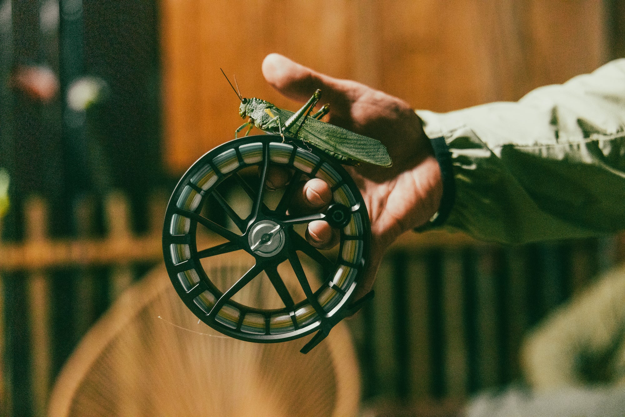 Lamson fly fishing large arbor reel with a grasshopper on it
